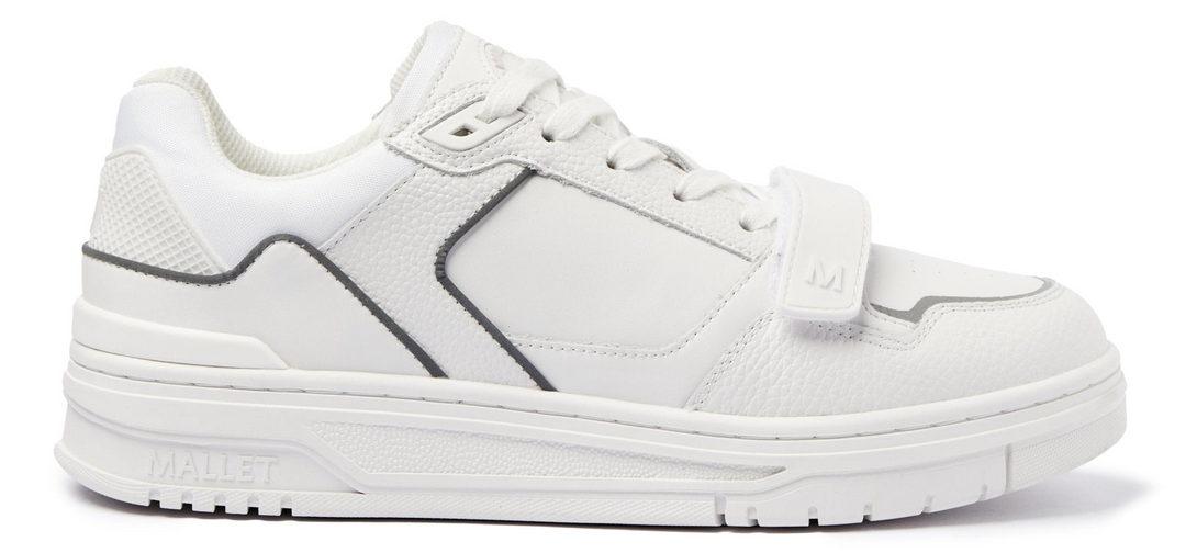 White sneaker with black accents on a white background