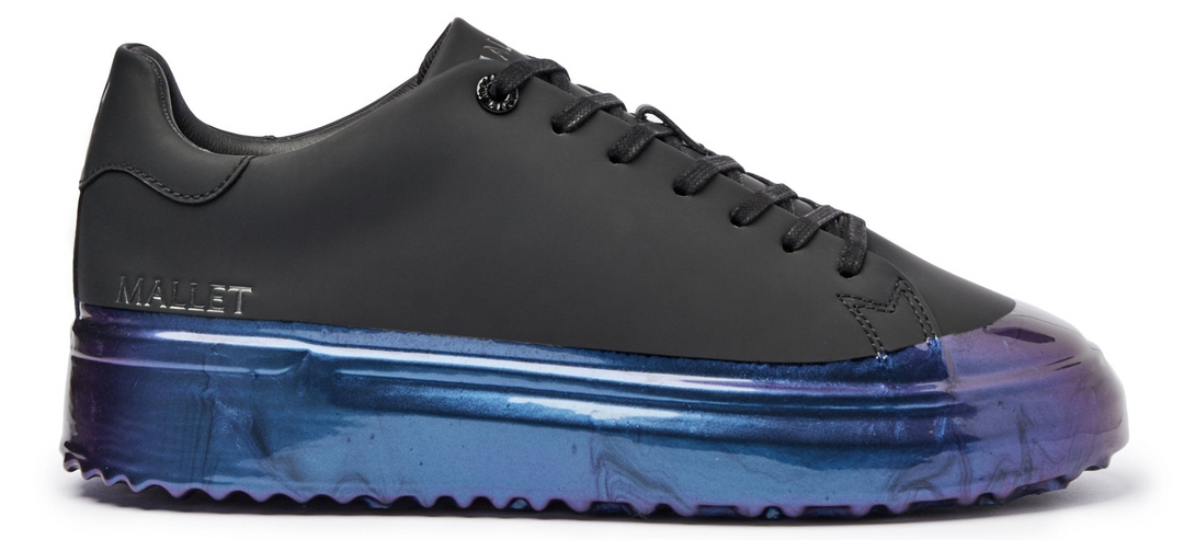 Iridescent dip black trainers on a white background