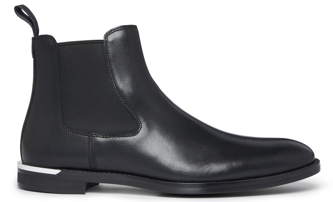 Black leather Chelsea boot on a white background
