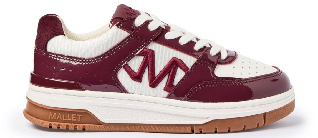 cranberry and white gum sole trainer on a white background