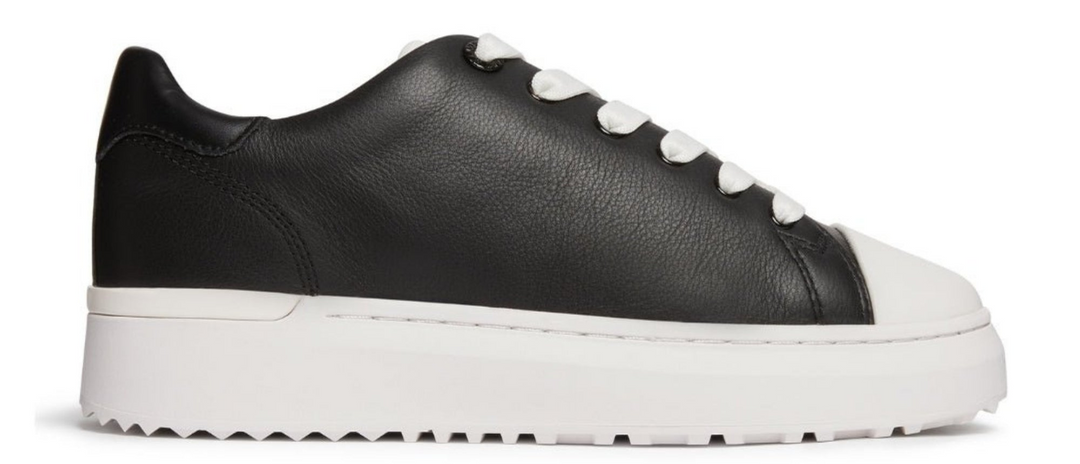 black leather trainer with white sole and laces on a white background 
