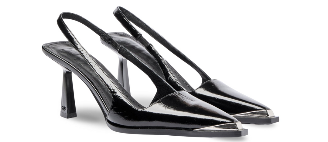 designer black leather slingback heels on a white background