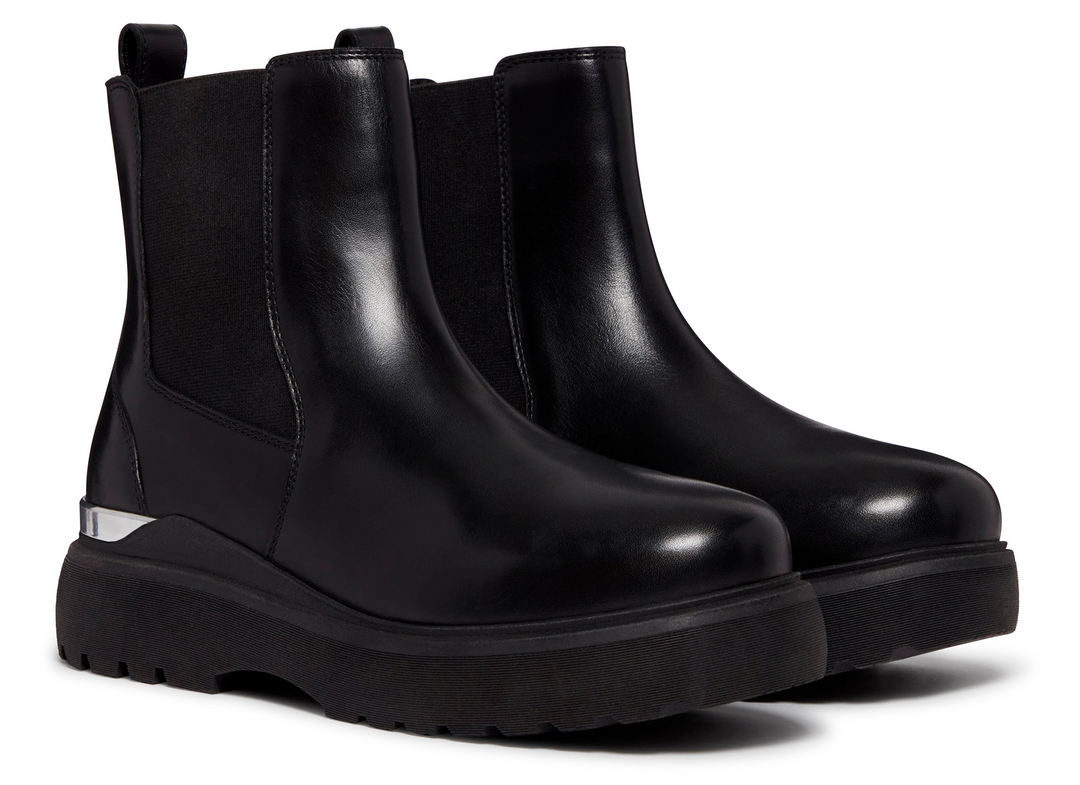 pair of black leather chelsea boots on a white background